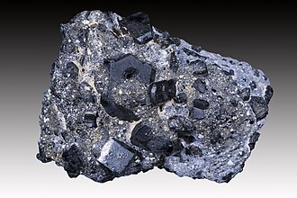 Augite specimen: black and dark green mineral