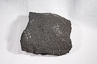 Basaltic Andesite specimen: dark gray and black igneous rock