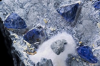 Benitoite specimen: blue and colorless mineral