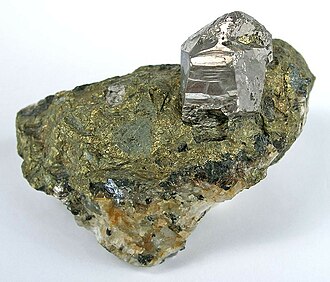 Cobaltite specimen: silvery white with pink/reddish tint and steel gray mineral