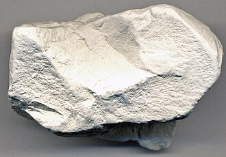 Kaolinite specimen: white and cream mineral (photo 2)
