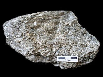 Schist specimen: silver-gray and golden (mica-rich) metamorphic rock