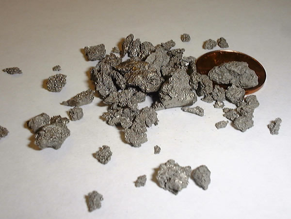 Titanium specimen Titanium specimen: silver and gray metal